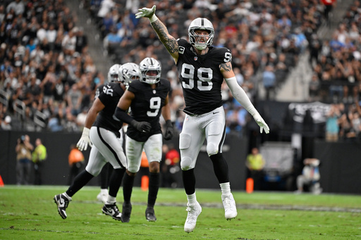 Las Vegas Raiders defensive end Maxx Crosby (98) celebrates after sacking Tennessee Titans quarterback Cam Ward during the first half of an NFL football game, Sunday, Oct. 12, 2025, in Las Vegas. (AP Photo/David Becker) Las Vegas Raiders defensive end Maxx Crosby (98) celebrates after sacking Tennessee Titans quarterback Cam Ward during the first half of an NFL football game, Sunday, Oct. 12, 2025, in Las Vegas. (AP Photo/David Becker)