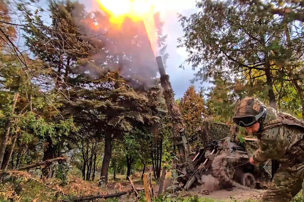 In this photo taken from video distributed by Russian Defense Ministry Press Service on Thursday, Oct. 23, 2025, the Russian 240mm "Tyulpan" mortar fires towards Ukrainian positions on an undisclosed location in Ukraine. (Russian Defense Ministry Press Service via AP)