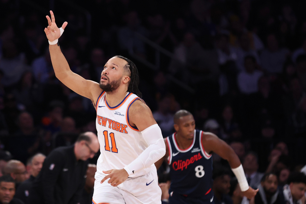 New York Knicks guard Jalen Brunson (11) gestures after scoring a 3-point basket against the LA Clippers during the first half of an NBA basketball game, Wednesday, Jan. 7, 2026, in New York. (AP Photo/Heather Khalifa)
