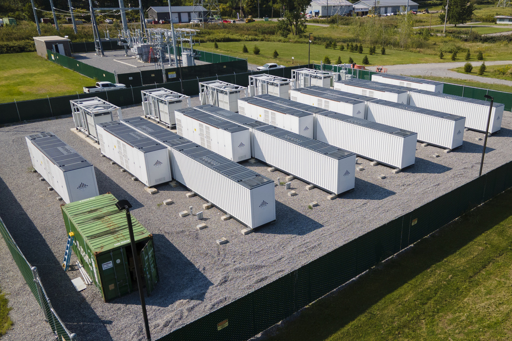 A large lithium battery energy storage system operated by Key Capture Energy that can power 15,000 homes for two hours during outages or high demand sits surrounded by a fence in Blasdell, N.Y., Tuesday, Sept. 9, 2025. (AP Photo/Ted Shaffrey)