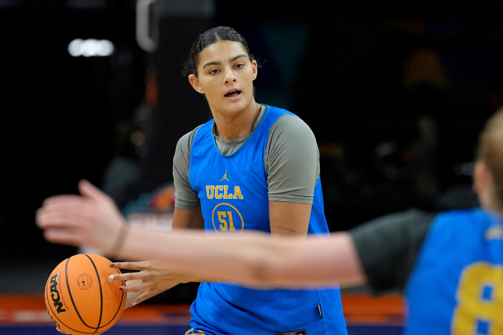 UCLA center Lauren Betts passes the ball during practice prior to the national semifinals at the Women's Final Four of the NCAA college basketball tournament, Thursday, April 2, 2026, in Phoenix. (AP Photo/Ross D. Franklin)