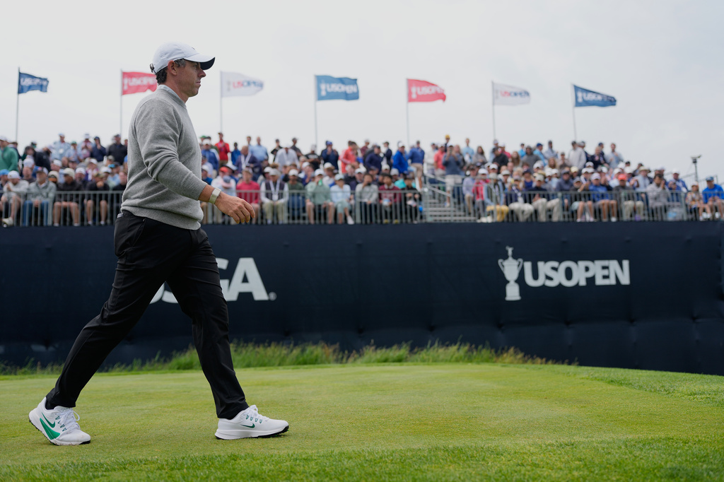 Rory McIlroy, of Northern Ireland, walks off the tee on the 12th hole during the first round of the U.S. Open golf tournament at Shinnecock Hills Golf Club in Southampton, N.Y., Thursday, June 18, 2026.(AP Photo/George Walker IV)