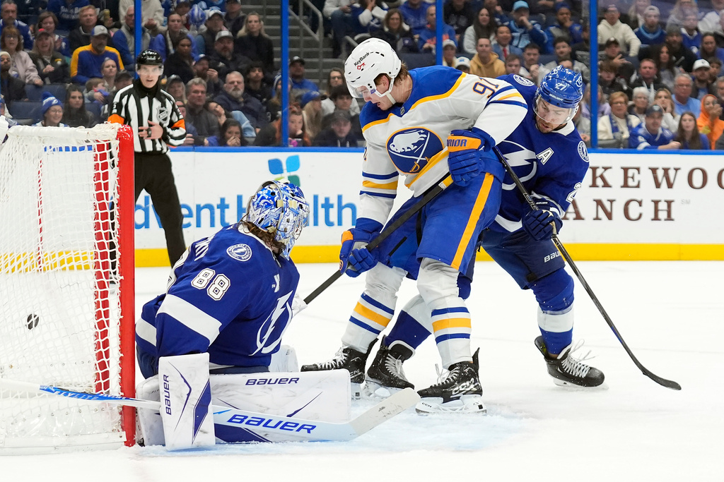 Buffalo Sabres right wing Josh Doan (91) scores past Tampa Bay Lightning goaltender Andrei Vasilevskiy (88) during the third period of an NHL hockey game Tuesday, Feb. 3, 2026, in Tampa, Fla. (AP Photo/Chris O'Meara)