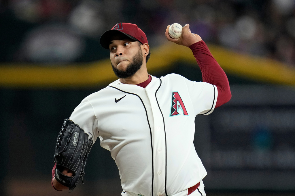 Arizona Diamondbacks starting pitcher Eduardo Rodriguez throws against the St. Louis Cardinals during the first inning of a baseball game, Sunday, July 19, 2026, in Phoenix. (AP Photo/Ross D. Franklin)