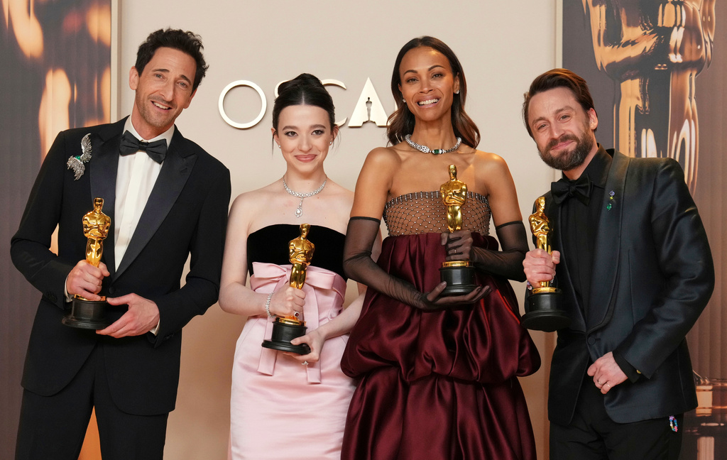 FILE - Adrien Brody, from left, winner of the award for best performance by an actor in a leading role for "The Brutalist," Mikey Madison, winner of the award for best performance by an actress in a leading role for "Anora," Zoe Saldana, winner of the award for best performance by an actress in a supporting role for "Emilia Perez," and Kieran Culkin, winner of the award for best performance by an actor in a supporting role for "A Real Pain," pose in the press room at the Oscars in Los Angeles on March 2, 2025. (Photo by Jordan Strauss/Invision/AP File)