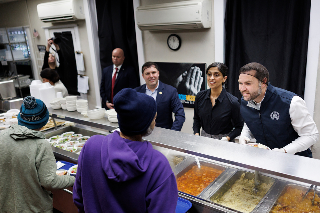 Vice President JD Vance and second lady Usha Vance serve food to attendees at the Allentown Rescue Mission in Allentown, Pa., Tuesday, Dec. 16, 2025. (Tom Brenner/The New York Times via AP, Pool)