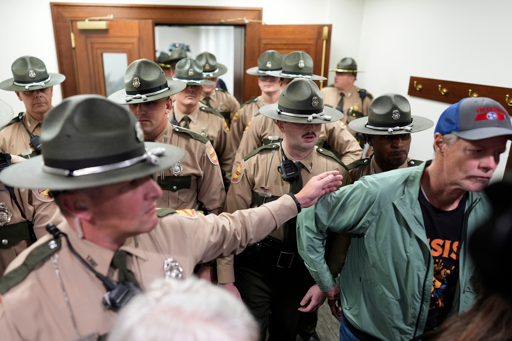 State troopers clear a House committee meeting after it was disrupted by protesters during a special session of the state legislature to redraw U.S. Congressional voting maps Wednesday, May 6, 2026, in Nashville, Tenn. (AP Photo/George Walker IV)