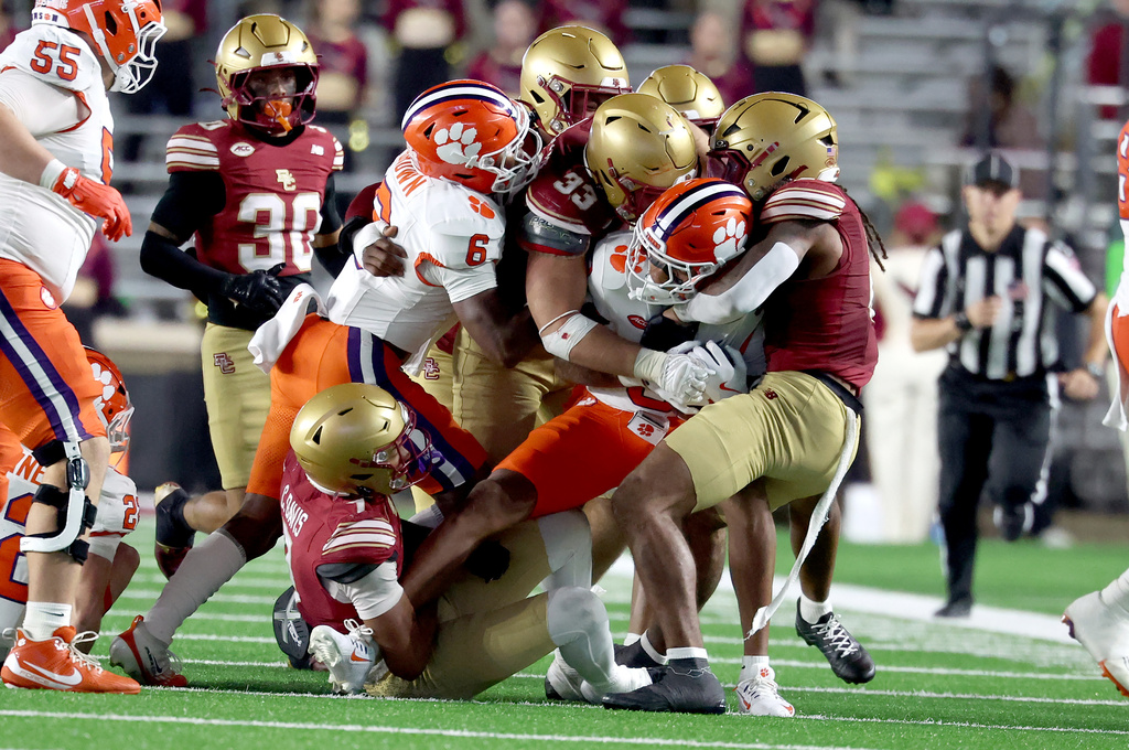 Clemson wide receiver Tristan Smith (3) gets tackled by Boston College defense during the second half of an NCAA college football game Saturday, Oct. 11, 2025 in Boston. (AP Photo/Mark Stockwell)
