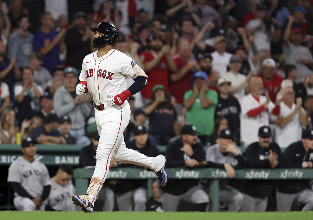 Boston Red Sox's Carlos Narvaez heads for home plate following his solo home run in the bottom of the first inning of a baseball game against the New York Yankees, Sunday, Sept. 14, 2025, in Boston. (AP Photo/Jim Davis)
