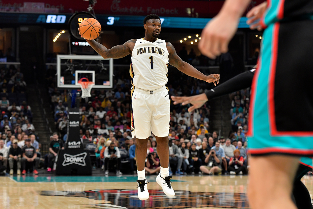 New Orleans Pelicans forward Zion Williamson (1) handles the ball against the Memphis Grizzlies in the first half of an NBA basketball game, Wednesday, Oct. 22, 2025, in Memphis, Tenn. (AP Photo/Brandon Dill)