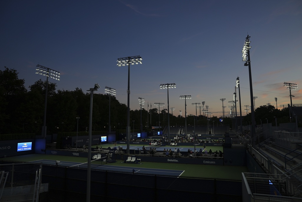 Shielded LED lights, approved by DarkSky International, illuminate the courts during the U.S. Open tennis tournament at the USTA Billie Jean King National Tennis Center in New York, on Monday, Aug. 18, 2025. (AP Photo/Mary Conlon)