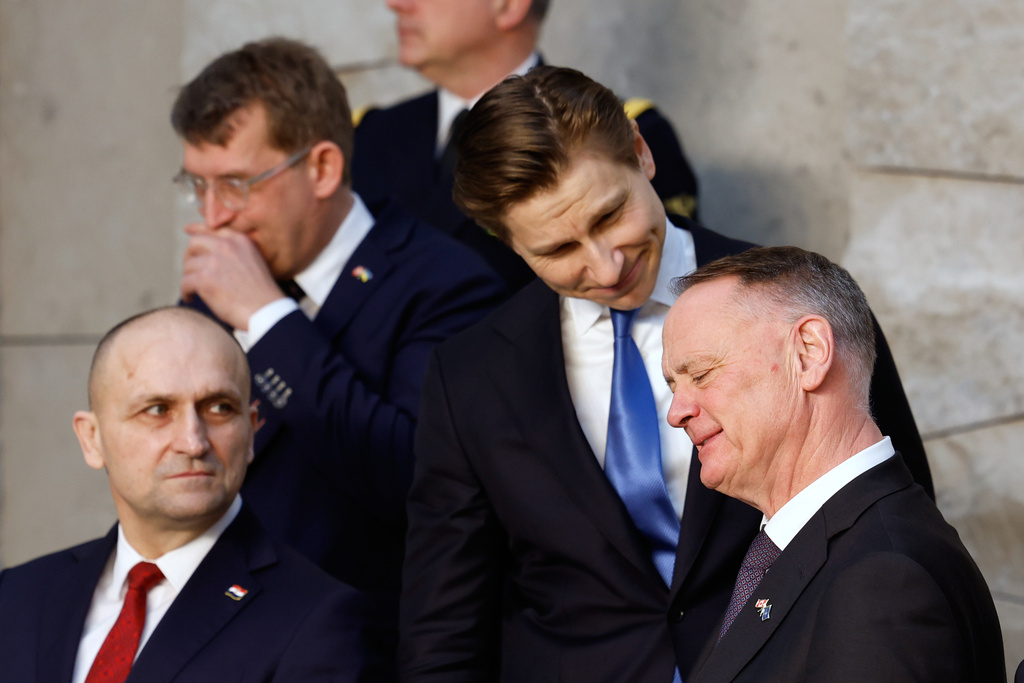 From left, Croatia's Defense Minister Ivan Anusic, Denmark's Defense Minister Troels Lund Poulsen, Finland's Defense Minister Antti Hakkanen and Canada's Defense Minister David McGuinty speak at a group photo during a meeting of NATO defense ministers at NATO headquarters in Brussels, Thursday, Feb. 12, 2026. (AP Photo/Geert Vanden Wijngaert)