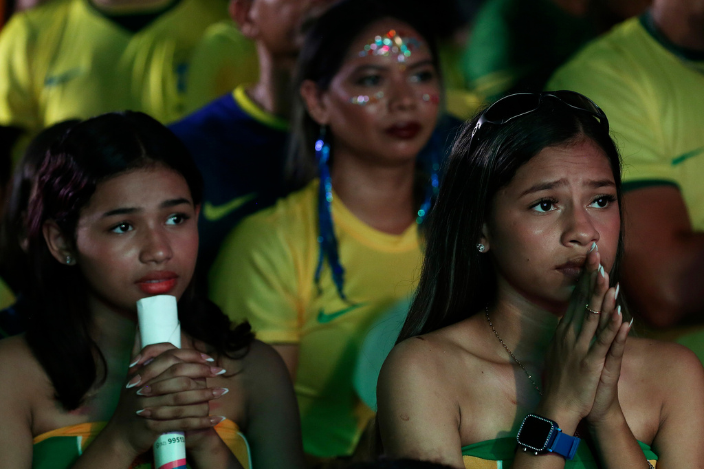 Brazil fans react while watching the World Cup match between Brazil and Morocco in Manaus, Brazil, Saturday, June 13, 2026. (AP Photo/Edmar Barros)