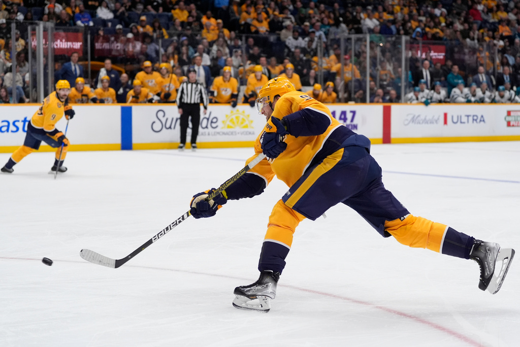 Nashville Predators center Steven Stamkos (91) shoots the puck to score a goal during the second period of an NHL hockey game against the San Jose Sharks, Tuesday, March 24, 2026, in Nashville, Tenn. (AP Photo/George Walker IV)