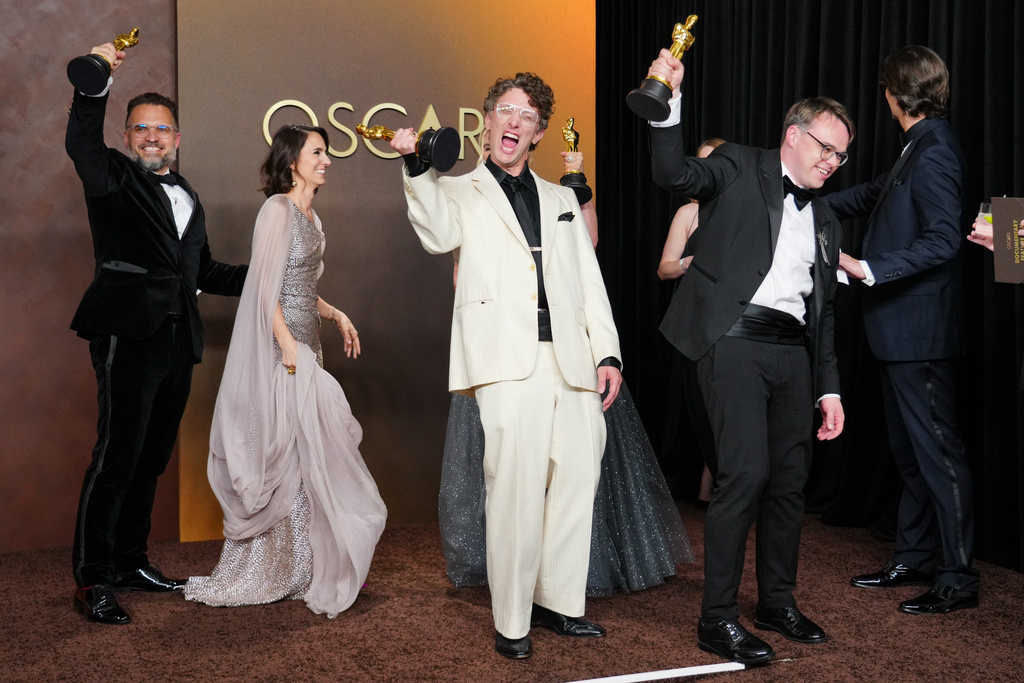 Radovan Sibrt, from left, Alzbeta Karaskova, David Borenstein, and Pavel Talankin, winners of the award for documentary feature film for "Mr. Nobody Against Putin," pose in the press room at the Oscars on Sunday, March 15, 2026, at the Dolby Theatre in Los Angeles. (Photo by Jordan Strauss/Invision/AP)