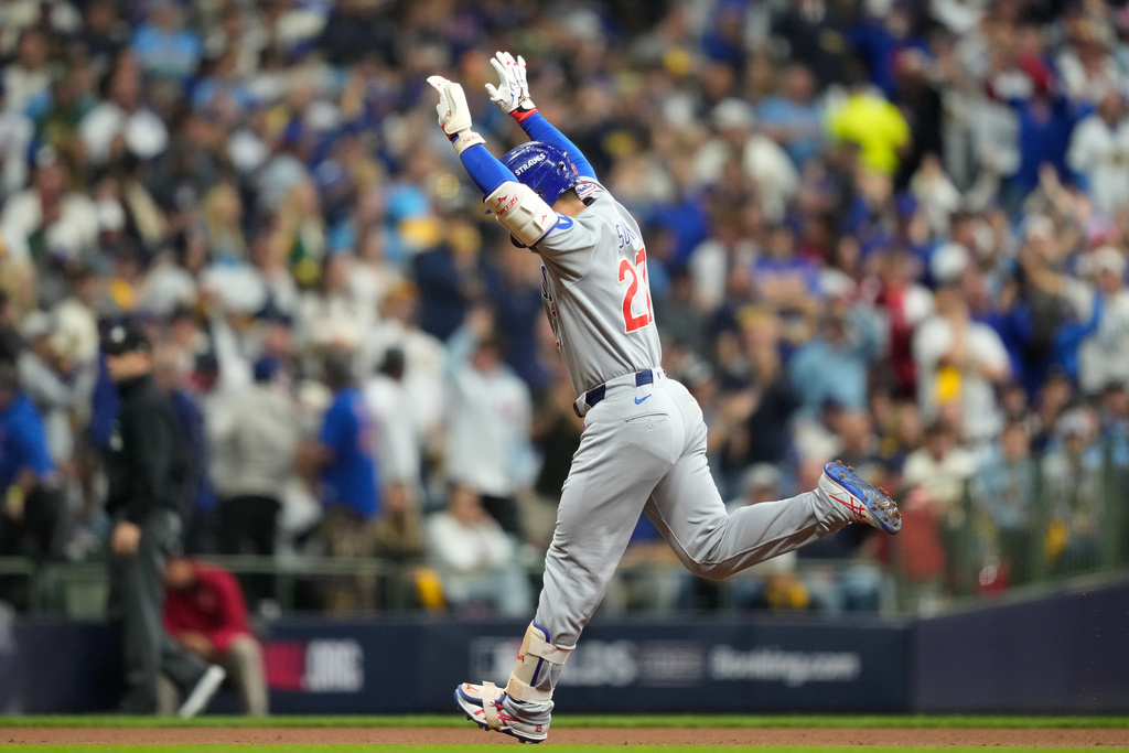 Chicago Cubs right fielder Seiya Suzuki (27) reacts after hitting a solo home run against the Milwaukee Brewers during the second inning of Game 5 of baseball's National League Division Series Saturday, Oct. 11, 2025, in Milwaukee. (AP Photo/Kayla Wolf)