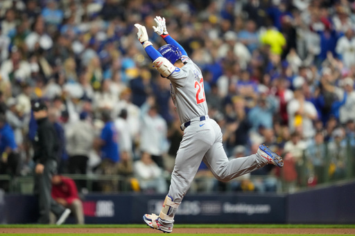 Chicago Cubs right fielder Seiya Suzuki (27) reacts after hitting a solo home run against the Milwaukee Brewers during the second inning of Game 5 of baseball's National League Division Series Saturday, Oct. 11, 2025, in Milwaukee. (AP Photo/Kayla Wolf) Chicago Cubs right fielder Seiya Suzuki (27) reacts after hitting a solo home run against the Milwaukee Brewers during the second inning of Game 5 of baseball's National League Division Series Saturday, Oct. 11, 2025, in Milwaukee. (AP Photo/Kayla Wolf)