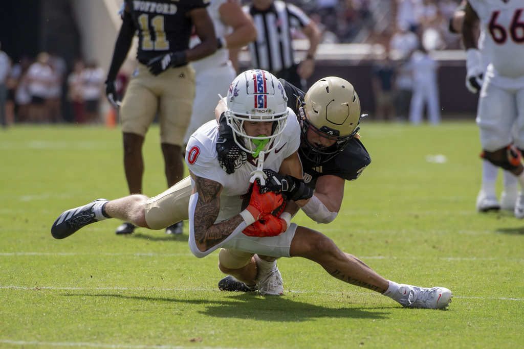Virginia Tech wide receiver Ayden Greene (0) dives for the first down against Wofford during the first half of an NCAA college football game Saturday, Sept. 20 2025, in Blacksburg, Va. (AP Photo/Robert Simmons)