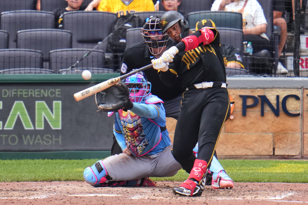 Pittsburgh Pirates' Esmerlyn Valdez hits a grand slam home run off Milwaukee Brewers pitcher Aaron Ashby during the seventh inning of the first game of a baseball doubleheader in Pittsburgh, Saturday, July 11, 2026. (AP Photo/Gene J. Puskar)