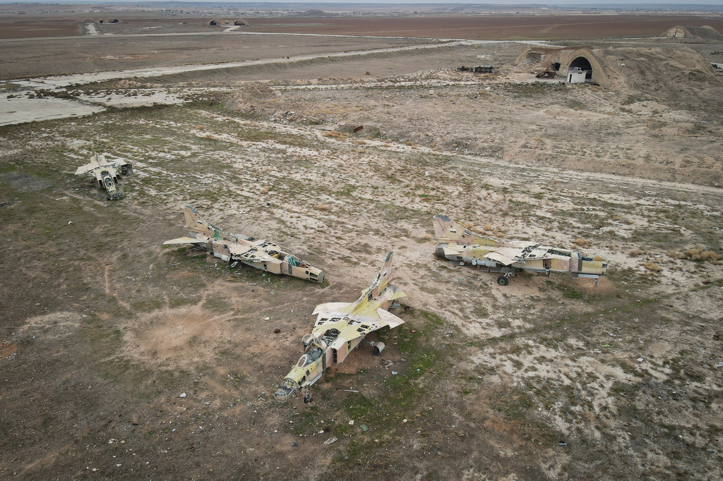 FILE - Decommissioned Syrian air force planes are seen at the Abu Duhur military air base east of Idlib, following the takeover of the area by Syrian opposition fighters on Saturday, Dec. 7, 2024. (AP Photo/Omar Albam, File)