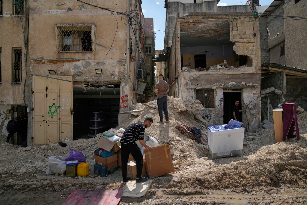 FILE - Residents of the now evacuated Palestinian refugee camp of Tulkarem return to collect belongings before the destruction of their homes as Israeli forces prepare to carry out the demolition of 116 homes across the two refugee camps of the Israeli occupied West Bank city of Tulkarem, Friday, May 2, 2025. (AP Photo/Nasser Nasser, File)