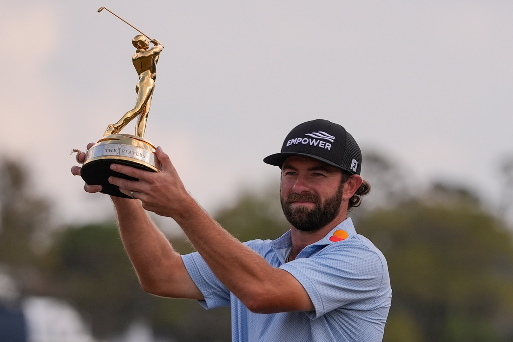 Cameron Young holds the The Players Championship Trophy after the final round of The Players Championship golf tournament, Sunday, March 15, 2026, in Ponte Vedra Beach, Fla. (AP Photo/Gerald Herbert)