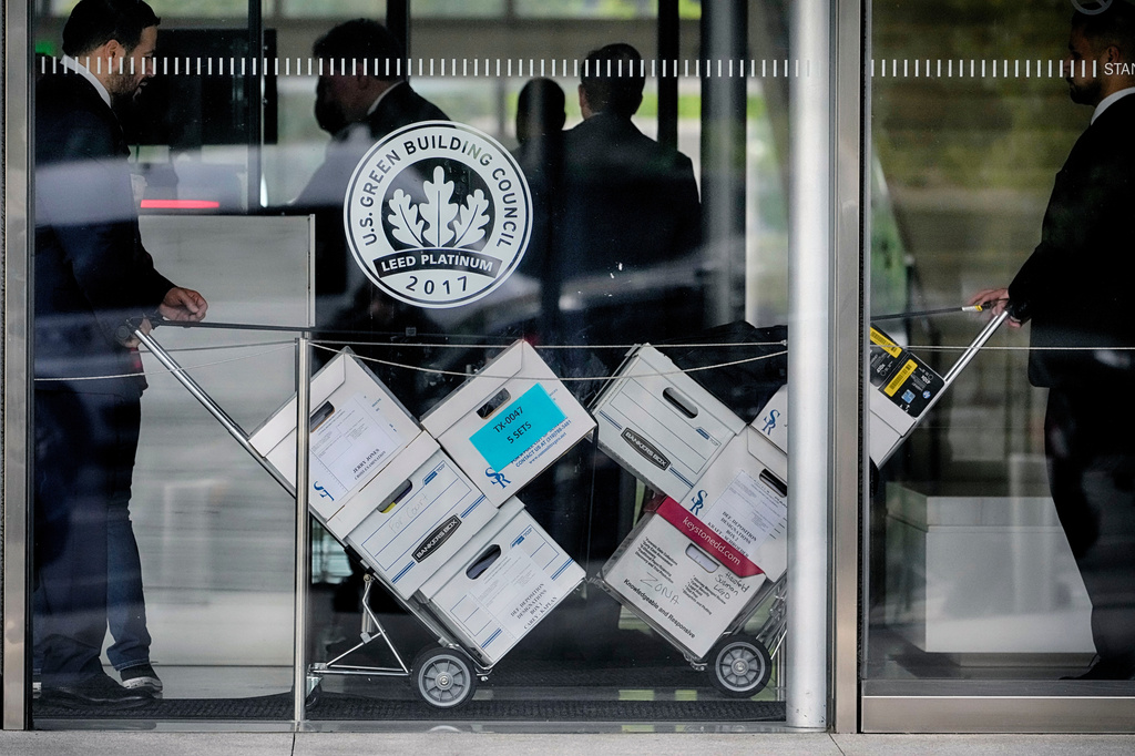 FILE - Case documents for a class-action lawsuit filed by "Sunday Ticket" subscribers are wheeled into federal court on June 17, 2024, in Los Angeles. (AP Photo/Damian Dovarganes, File)