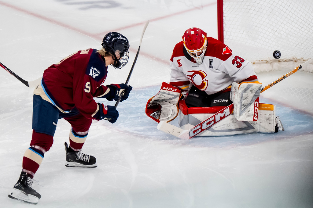 Montreal Victoire's Kati Tabin (9) scores on Ottawa Charge goaltender Gwyneth Philips (33) during the second period in Game 2 of the PWHL Walter Cup finals hockey series in Laval, Quebec, Saturday, May 16, 2026.(Christopher Katsarov/The Canadian Press via AP)