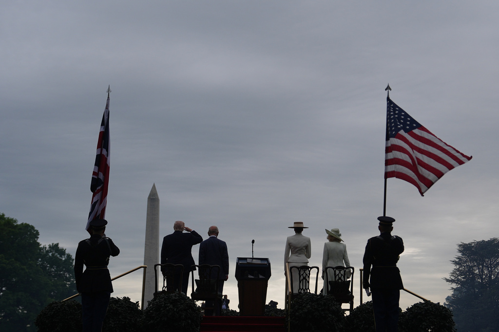 FILE - President Donald Trump, from left, King Charles III, first lady Melania Trump and Queen Camilla stand for the national anthems of their respective countries during an arrival ceremony among others on the South Lawn of the White House, on April 28, 2026, in Washington. (AP Photo/Julia Demaree Nikhinson, File)