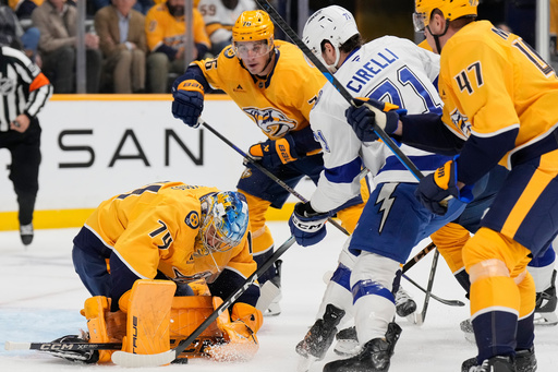 Nashville Predators goaltender Juuse Saros (74) defends the goal against the Tampa Bay Lightning center Anthony Cirelli (71) during the first period of an NHL hockey game Tuesday, Oct. 28, 2025, in Nashville, Tenn. (AP Photo/George Walker IV) Nashville Predators goaltender Juuse Saros (74) defends the goal against the Tampa Bay Lightning center Anthony Cirelli (71) during the first period of an NHL hockey game Tuesday, Oct. 28, 2025, in Nashville, Tenn. (AP Photo/George Walker IV)