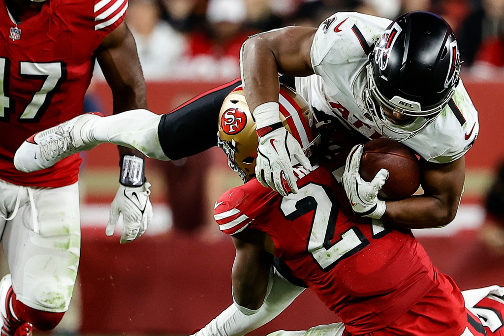 San Francisco 49ers safety Ji'Ayir Brown (27) tackles Atlanta Falcons running back Bijan Robinson (7) in the second half of an NFL football game, Sunday, Oct. 19, 2025, in Santa Clara, Calif. (AP Photo/Kelley L Cox)
