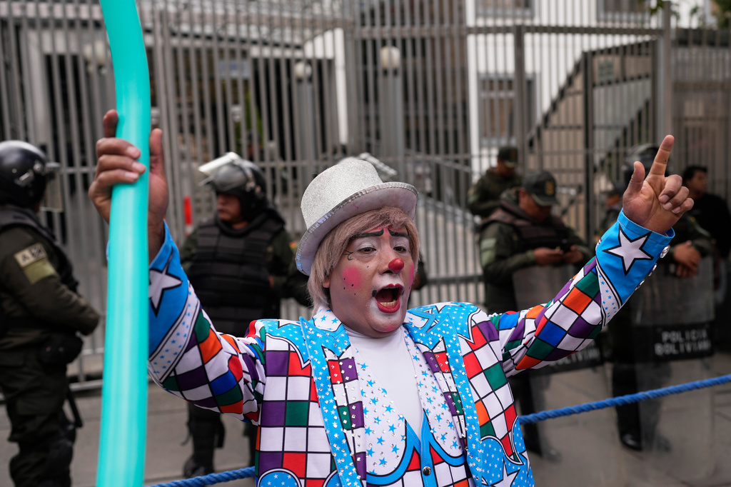 A clown shouts slogans during a protest against the government's ban on holiday parties at schools during teaching hours, outside the Ministry of Education in La Paz, Bolivia, Monday, March 30, 2026. (AP Photo/Juan Karita)