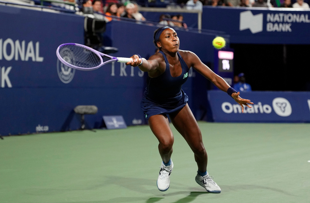 USA's Coco Gauff reaches for the ball against Kazakhstan's Elena Rybakina during a National Bank Open semi final tennis match in Toronto, Wednesday, August 12, 2026. (Chris Young/The Canadian Press via AP)