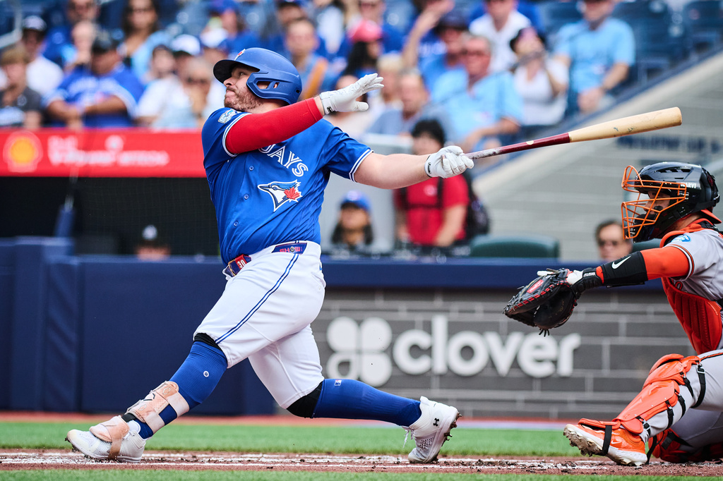 Toronto Blue Jays' Alejandro Kirk (30) hits an RBI single against the Baltimore Orioles during the first inning of a baseball game in Toronto, on Saturday, Sept. 12, 2026. (Sammy Kogan/The Canadian Press via AP)