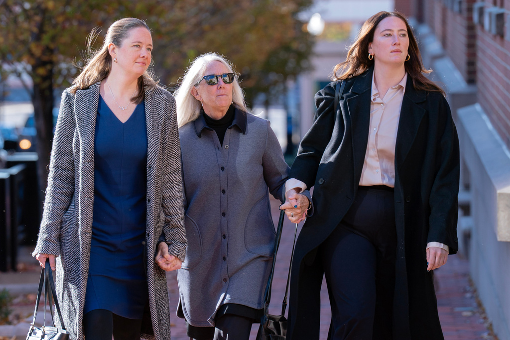 Patrice Failor, wife of former FBI Director James Comey, center, Claire Comey, right, and Maurene Comey, left, both daughters of former FBI Director James Comey, arrive at federal courthouse in Alexandria, Va., Thursday, Nov. 13, 2025. (AP Photo/Jose Luis Magana)