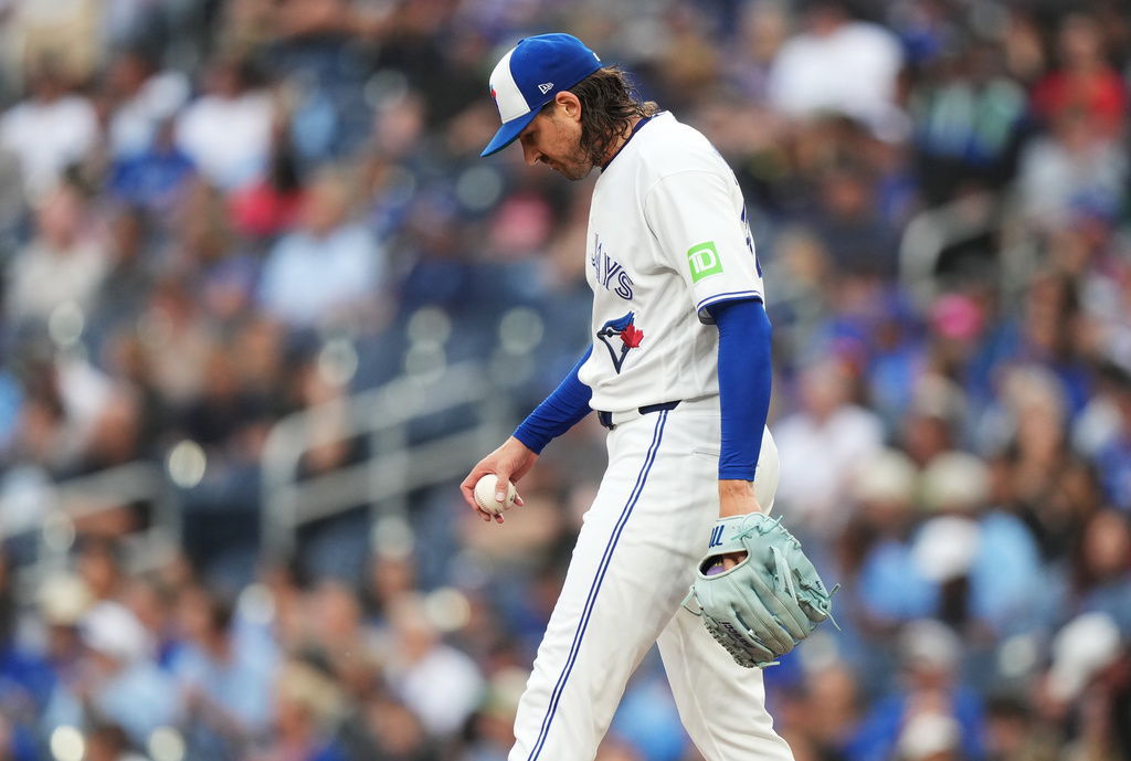 Toronto Blue Jays pitcher Kevin Gausman reacts after giving up a solo home run to Texas Rangers designated hitter Joc Pederson during the first inning of a baseball game in Toronto, Thursday, June 25, 2026. (Nathan Denette/The Canadian Press via AP)