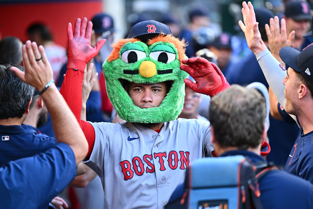 Boston Red Sox's Willson Contreras is greeted by teammates after hitting a three-run home run during the third inning of a baseball game against the Los Angeles Angels, Sunday, July 5, 2026, in Anaheim, Calif. (AP Photo/William Liang)