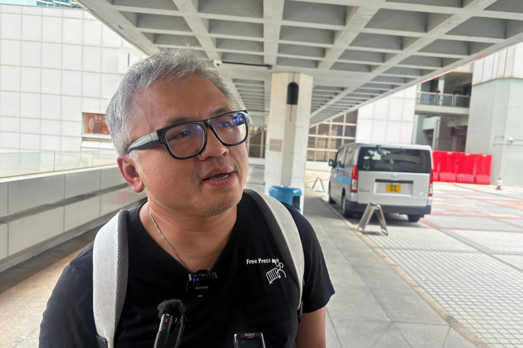 Ronson Chan, ex-chairman of the Hong Kong Journalists Association, speaks to reporters outside the High Court in Admiralty in Hong Kong before a ruling on his appeal against his conviction for obstructing a police officer, Friday, May 29, 2026. (AP Photo/Kanis Leung)