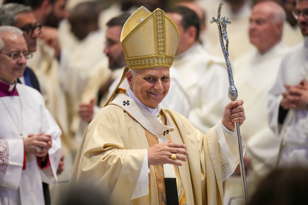Pope Leo XIV leaves after presiding over Sunday Mass in St. Peter's Basilica at the Vatican during which he made ten new priests, Sunday, April 26, 2026. (AP Photo/Alessandra Tarantino)