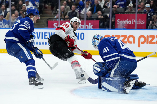 Toronto Maple Leafs goaltender Anthony Stolarz (41) makes a save on New Jersey Devils right wing Timo Meier (28) during the third period of an NHL hockey game in Toronto, Tuesday, Oct. 21, 2025. (Nathan Denette/The Canadian Press via AP) Toronto Maple Leafs goaltender Anthony Stolarz (41) makes a save on New Jersey Devils right wing Timo Meier (28) during the third period of an NHL hockey game in Toronto, Tuesday, Oct. 21, 2025. (Nathan Denette/The Canadian Press via AP)
