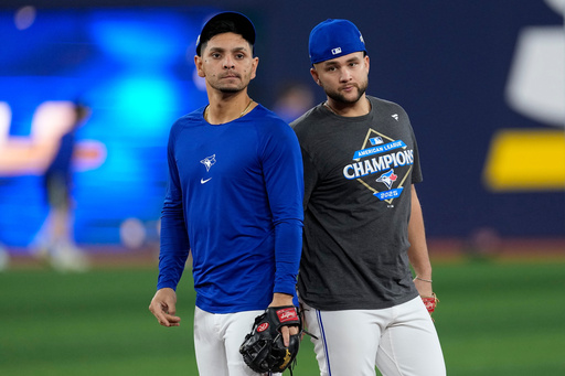 Toronto Blue Jays' Andrés Giménez, left, and Bo Bichette run drills during a World Series baseball media day, Thursday, Oct. 23, 2025, in Toronto. The Toronto Blue Jays face the Los Angeles Dodgers in Game 1 on Friday. (AP Photo/David J. Phillip) Toronto Blue Jays' Andrés Giménez, left, and Bo Bichette run drills during a World Series baseball media day, Thursday, Oct. 23, 2025, in Toronto. The Toronto Blue Jays face the Los Angeles Dodgers in Game 1 on Friday. (AP Photo/David J. Phillip)