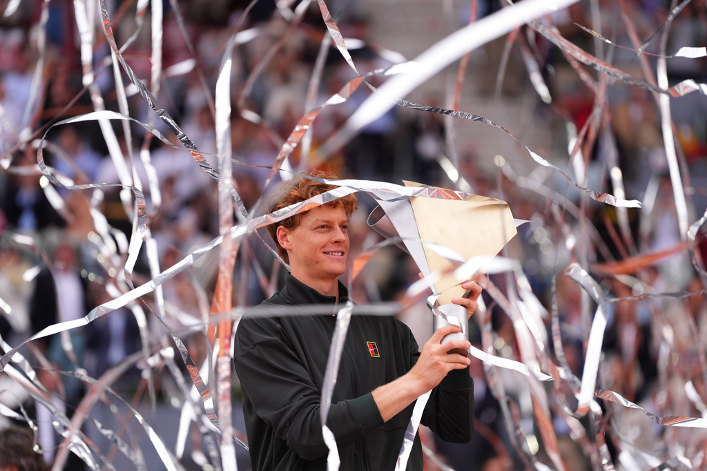 Jannik Sinner, of Italy, holds the trophy after winning the men's singles tennis final match against Alexander Zverev, of Germany, at the Madrid Open tennis tournament in Madrid, Spain, Sunday, May 3, 2026. (AP Photo/Manu Fernandez)