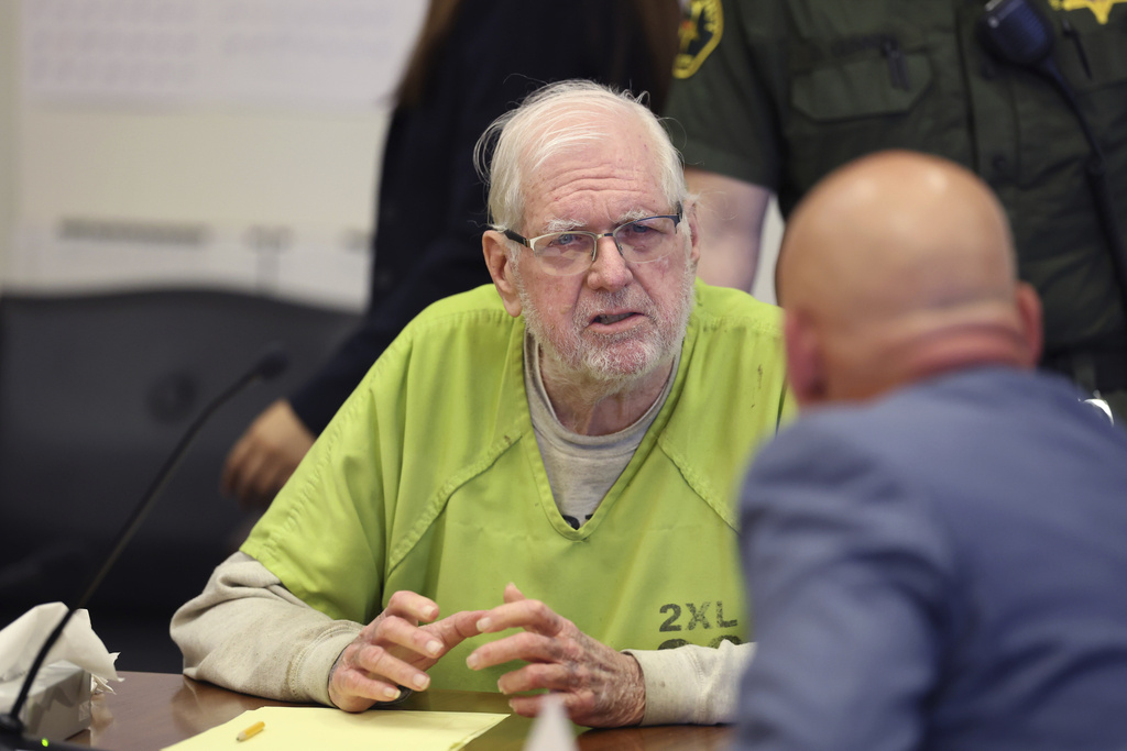 Orange County Superior Court Judge Jeffrey Ferguson listens to his lawyers as he is sentenced to 35 years to life in prison after his second-degree murder conviction for shooting his wife following an hours-long argument at the Central Justice Center in Santa Ana, Calif., Wednesday, Sept. 17, 2025. (Allen J. Schaben/Los Angeles Times via AP, Pool)