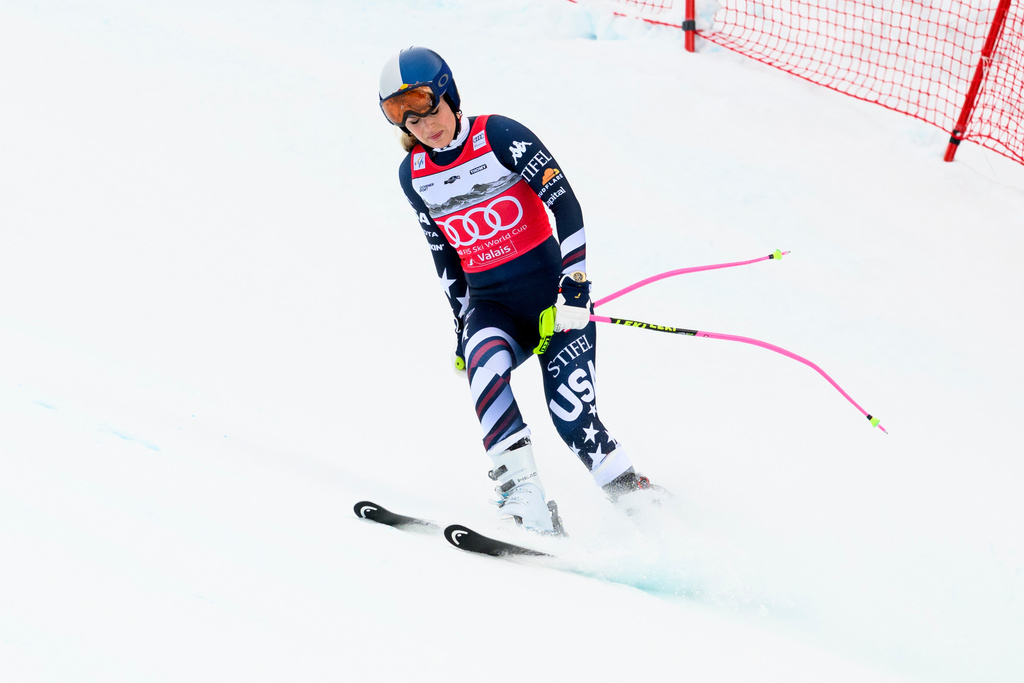 United States' Lindsey Vonn approaches the finish area after crashing, during an alpine ski, women’s World Cup downhill, in Crans Montana, Switzerland, Friday, Jan. 30, 2026. (Jean-Christophe Bott/Keystone via AP)
