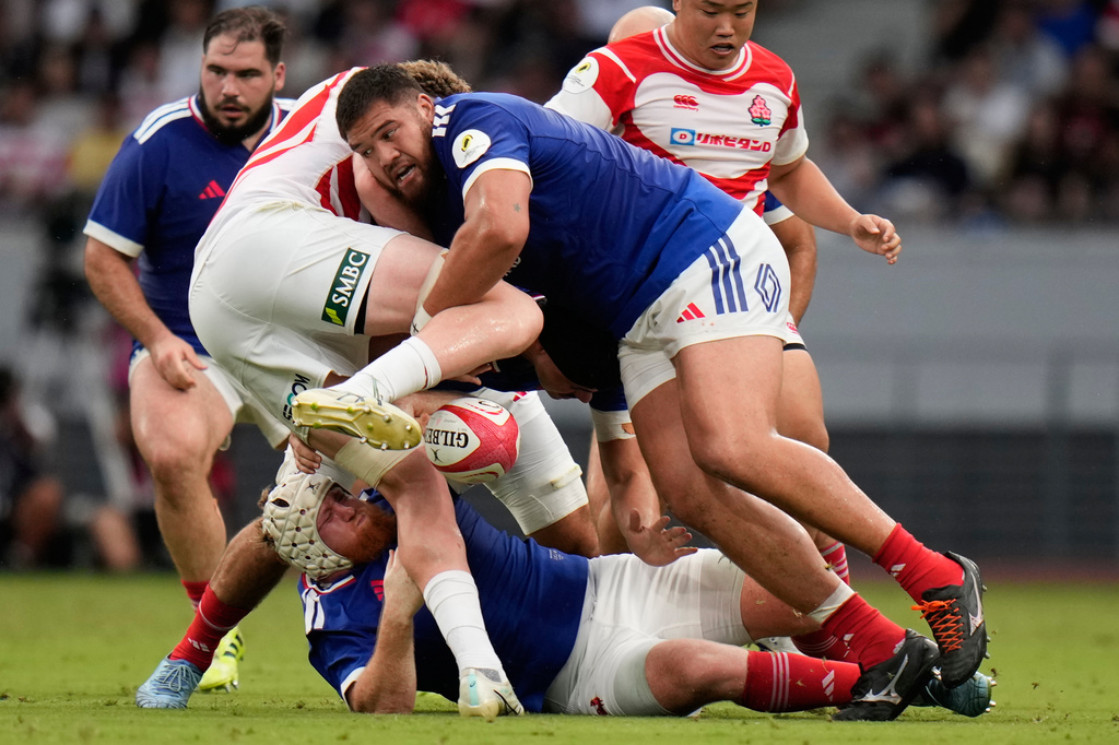 France's Emmanuel Meafou, second from right, is tackled during a Nations Championship rugby match between Japan and France in Tokyo, Saturday, July 18, 2026. (AP Photo/Shuji Kajiyama)
