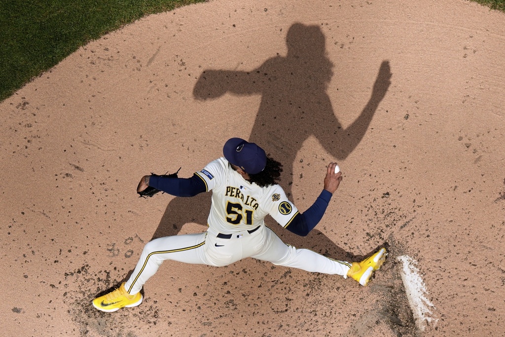 Milwaukee Brewers' Freddy Peralta throws during the fourth inning of a baseball game against the Philadelphia Phillies Thursday, Sept. 4, 2025, in Milwaukee. (AP Photo/Morry Gash)