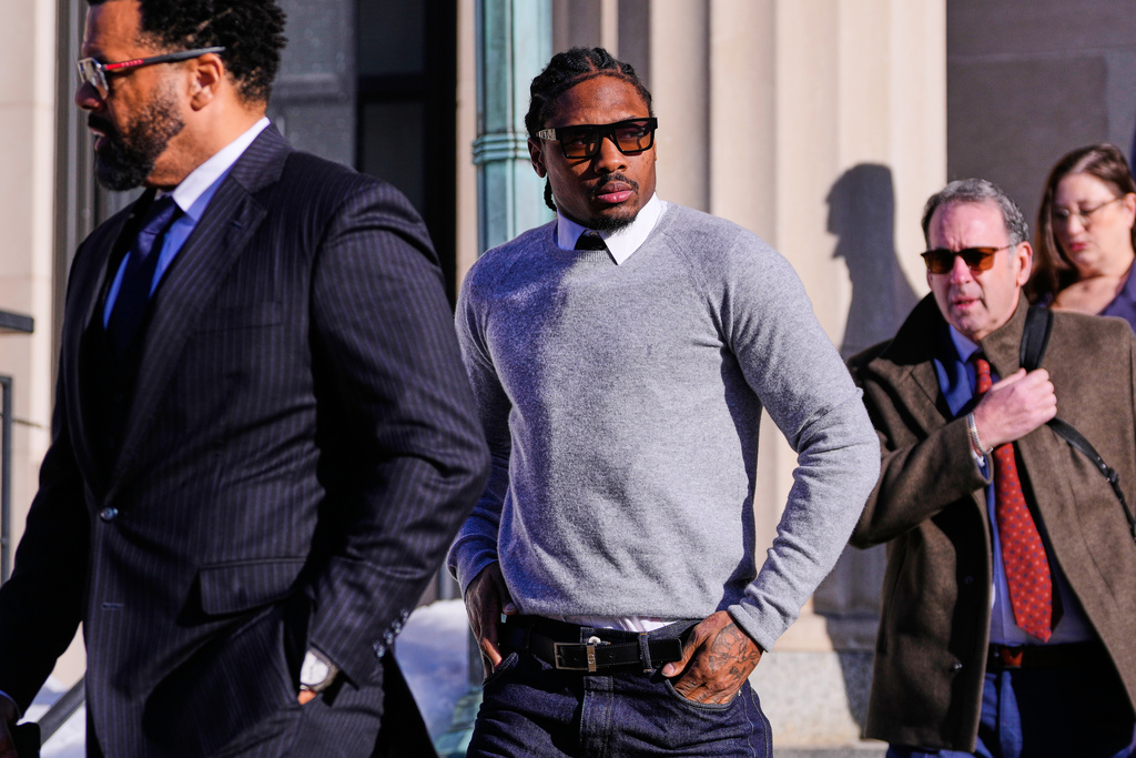 New England Patriots wide receiver Stefon Diggs leaves Norfolk County District Court after his arraignment on felony strangulation and a misdemeanor assault charges, Friday, Feb. 13, 2026, in Dedham, Mass. (AP Photo/Charles Krupa)