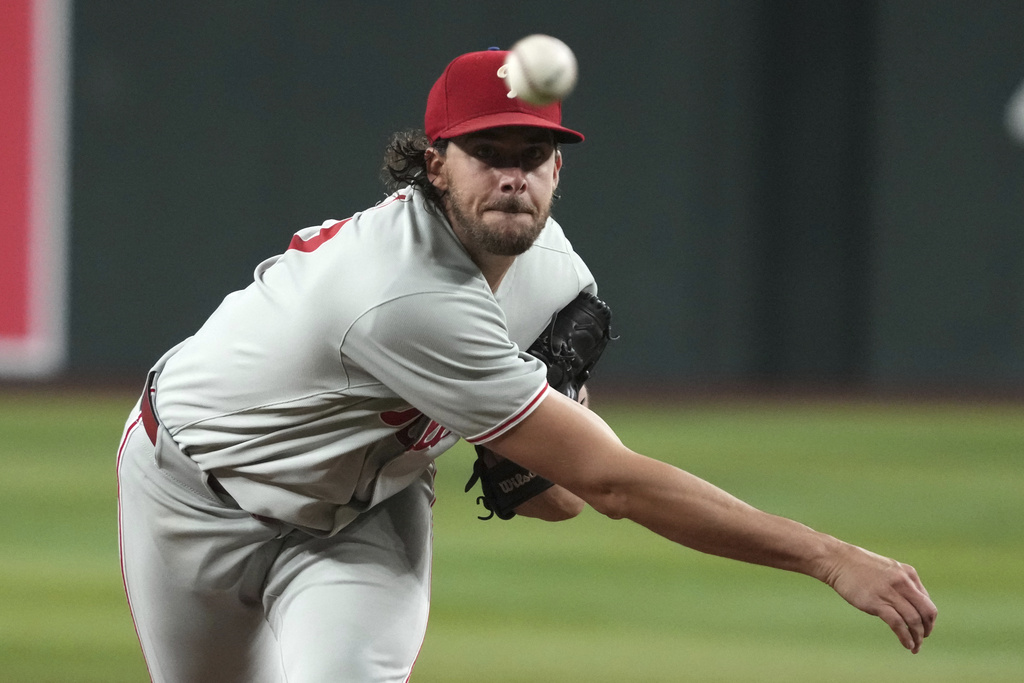 Philadelphia Phillies pitcher Aaron Nola throws against the Arizona Diamondbacks in the first inning of a baseball game, Saturday, Sept. 20, 2025, in Phoenix. (AP Photo/Rick Scuteri)