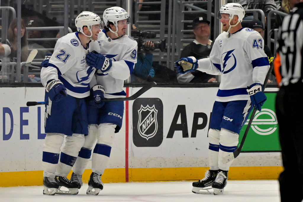 Tampa Bay Lightning center Brayden Point (21), Lightning center Gage Goncalves and Lightning defenseman Darren Raddysh (43) celebrate after a goal during the second period of an NHL hockey game against the Los Angeles Kings, Thursday, Jan. 1, 2026, in Los Angeles. (AP Photo/Jayne Kamin-Oncea)