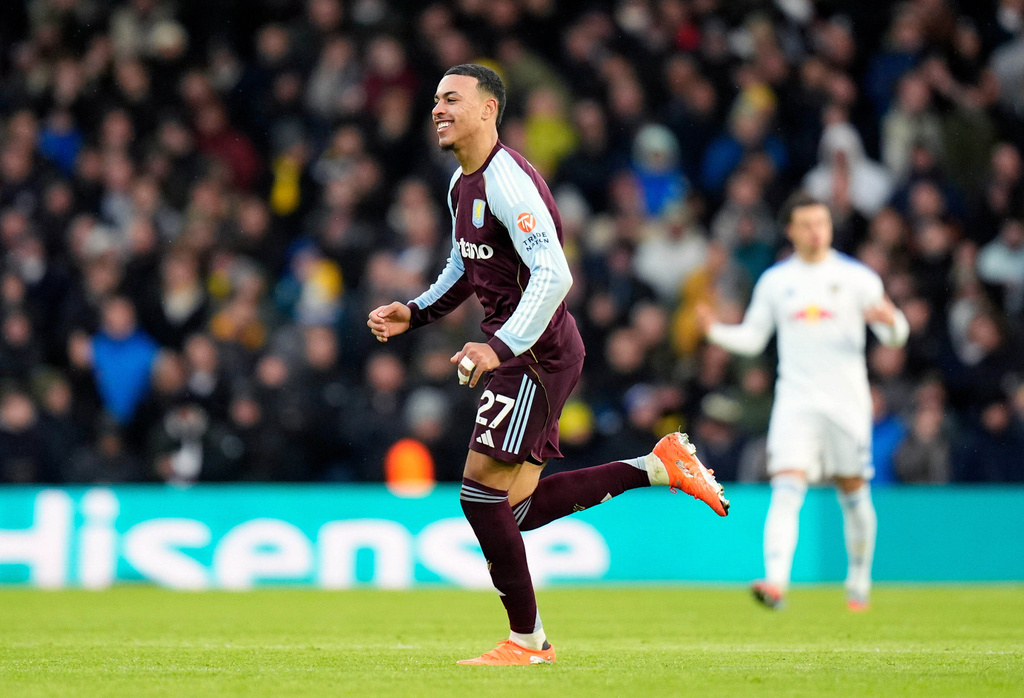 Aston Villa's Morgan Rogers celebrates scoring their side's first goal of the game during the Premier League match between Leeds and Aston Villa in Leeds, England, Sunday, Nov. 23, 2025. (Danny Lawson/PA via AP)